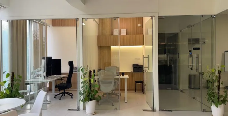 Back-office cabin with workstation and printer at the KV Consulting Bangalore office