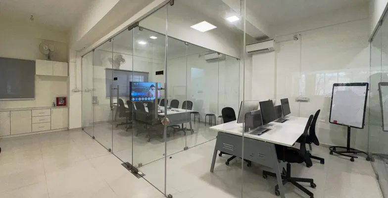 Glass-walled meeting room at the KV Consulting office in HSR Layout, Bangalore